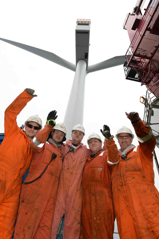 Seajacks deck crew (from left) Jamie Jilling, Charlie Varney, Dan Overton, Stuart Addison and Steve Nelson celebrate the final turbine installation on Sheringham Shoal.