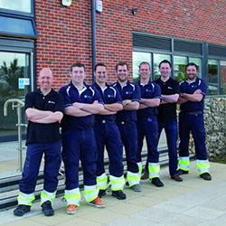 From L to R, Bryan Glasser, Sam Vincent, Andy Hack, John Boyes, Roy Wilkes, Richard Nunn and Mark Rockliff outside the Sheringham Shoal purpose built O&M base Wind Farm Place